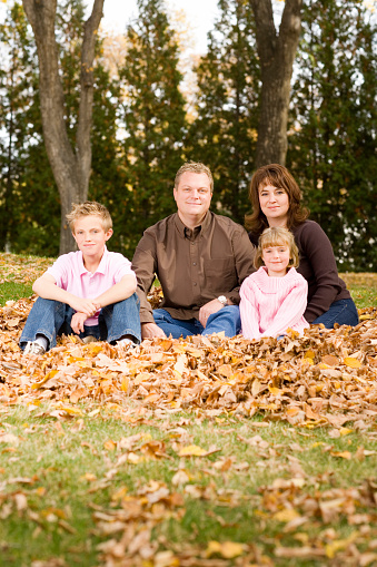 Vertical image of a beautiful young family.