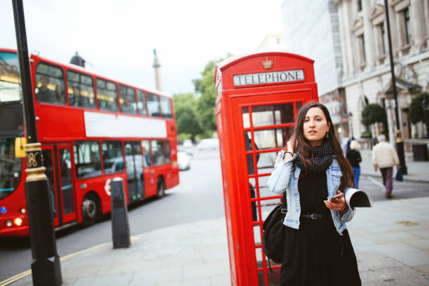 istock young woman walking in London 909190766
