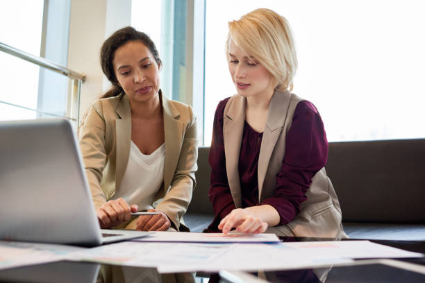 istock Discussing Work Results with Colleague 909193524