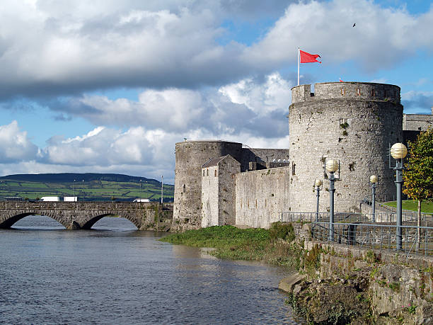istock Large stone castle with bridge and a red flag  90919877