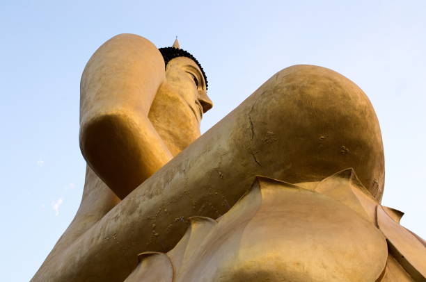 istock Big golden sitting Buddha statue in Pakse 909203082