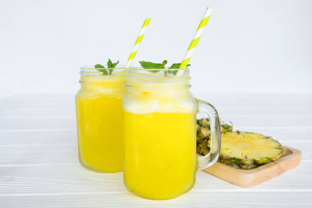 istock pineapple smoothie and pineapple fruits 909203206