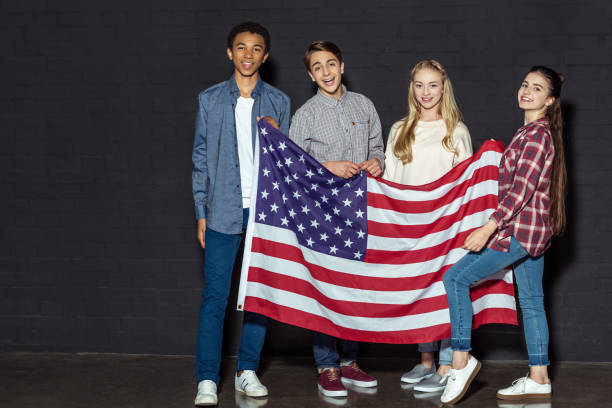 istock american teens with usa flag 909207174