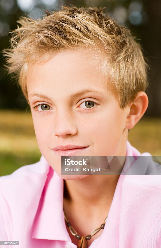 Male Portrait Vertical portrait of a young male looking in the camera with a slight smile on his face. 18-19 Years Stock Photo