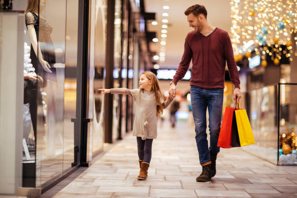 A day in the mall Father and daughter spending a day in shopping mall mall walker stock pictures, royalty-free photos & images
