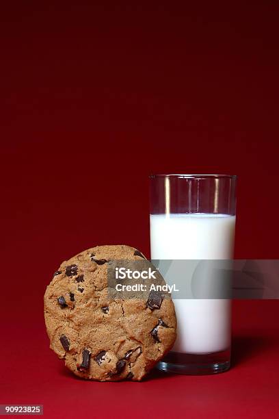 Milk And Cookie On Red Stock Photo - Download Image Now - Candy, Chocolate, Chocolate Chip