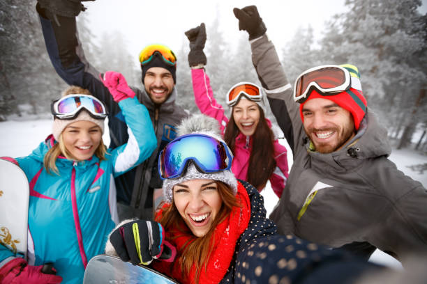 istock Cheerful skiers on skiing together 909240664
