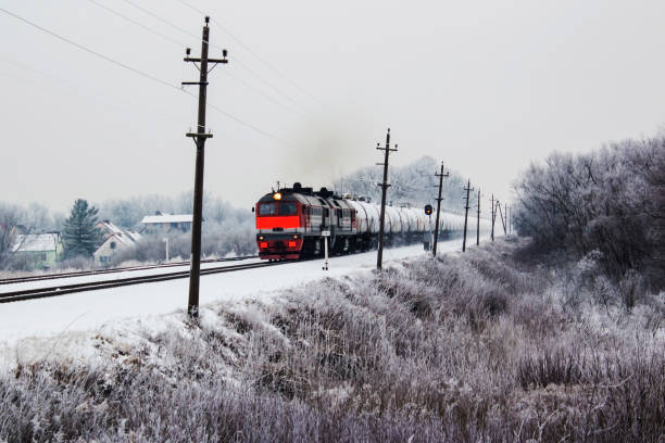 istock a bright orange freight train on the move in winter. 909240758