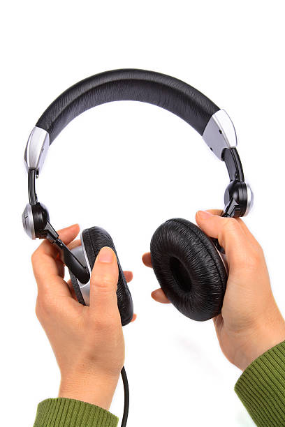 istock Woman holding earphones 90924812