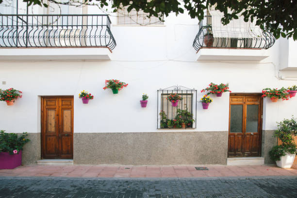 istock Street with flowers in Spain. 909249834