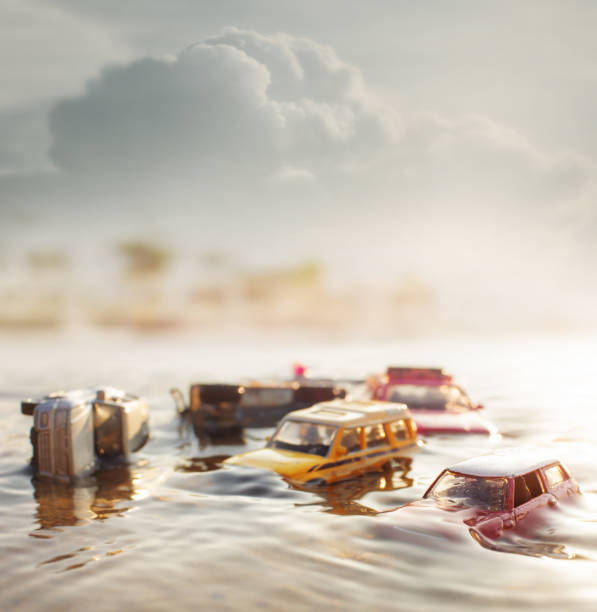 Scene of Crashed cars (miniature, toy model ) in flood from natural disasters. Scene of Crashed cars (miniature, toy model ) in flood from natural disasters.Selective focus. superstorm stock pictures, royalty-free photos & images