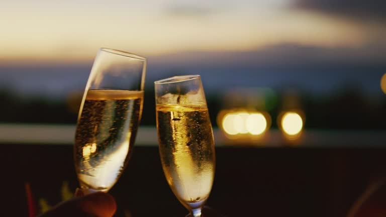 Couple Drinking Champagne at Sunset