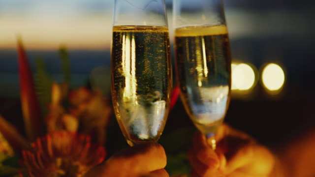 Couple Drinking Champagne at Sunset