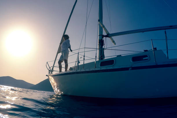 istock Woman enjoying her vacation on sailboat 909254384