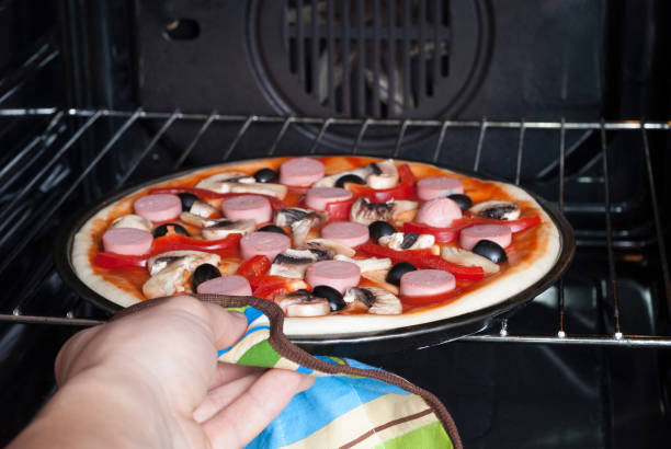 istock pizza in the electric oven 909262516