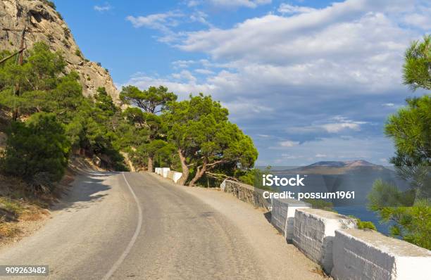 A Mountain Road Along The Seashore Stock Photo - Download Image Now - Antiquities, Asphalt, Beauty