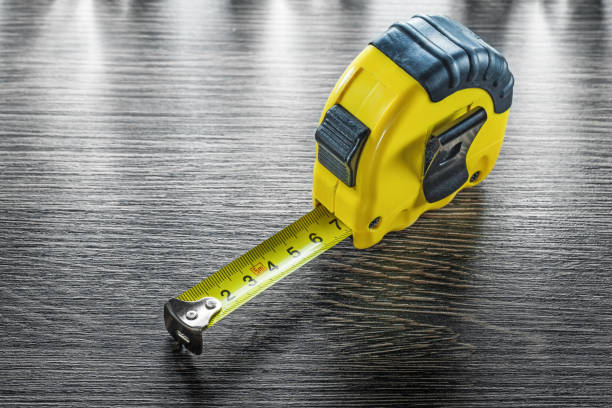 istock Construction tape line on wooden board 909268840