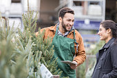 Christmas tree lot owner helps customer