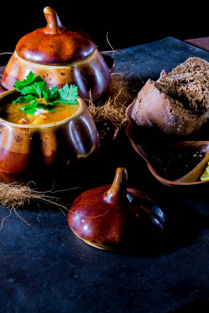 istock Soup from meat Solyanka in ceramic pots 909272540