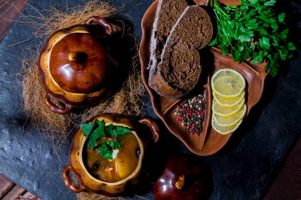 istock Soup from meat Solyanka in ceramic pots 909272582