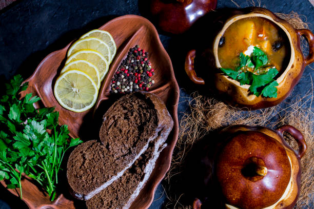 istock Soup from meat Solyanka in ceramic pots 909272642