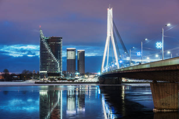 istock Nightly view on the Suspension bridge in Riga 909275264