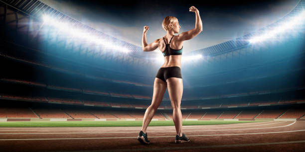 istock strong athletic woman on stadium 909279898