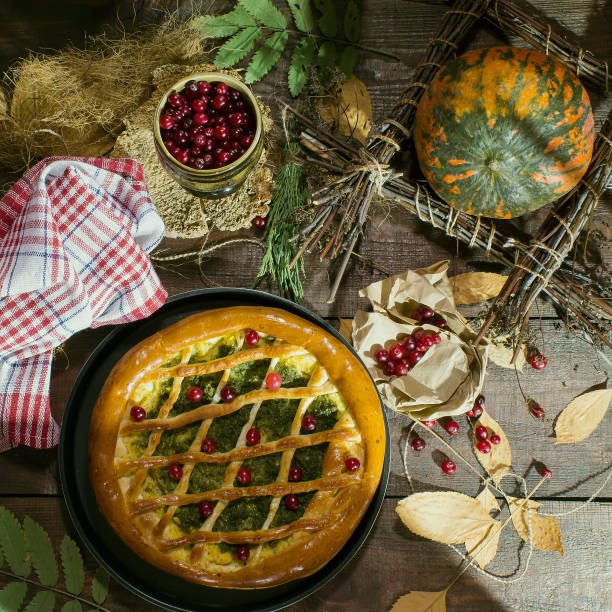 istock Pumpkin pie with spinach and herbs decorated with cranberry. Rustic style 909280326