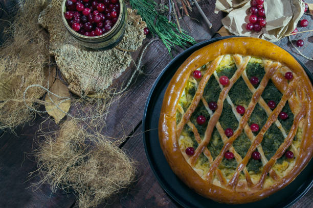 istock Pumpkin pie with spinach and herbs decorated with cranberry. Rustic style 909280372