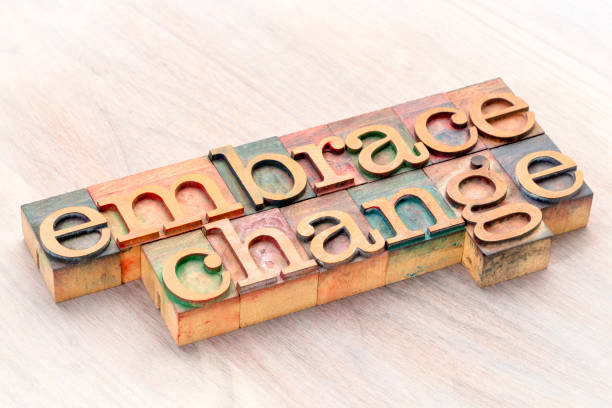 embrace change word abstract in wood type embrace change word abstract in letterprtess wood type blocks stained by color inks printing block photos stock pictures, royalty-free photos & images