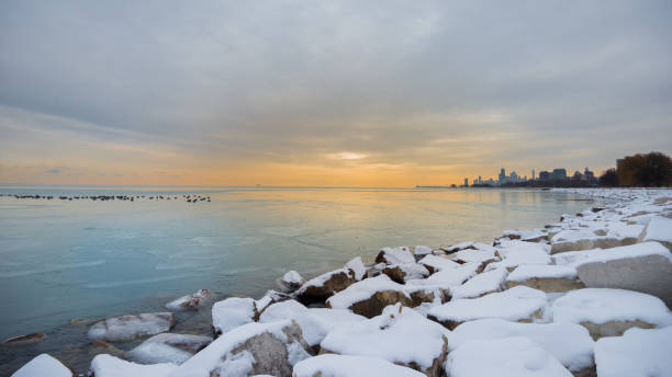 istock Sunrise over Lake Michigan while Ice Covered 909284150