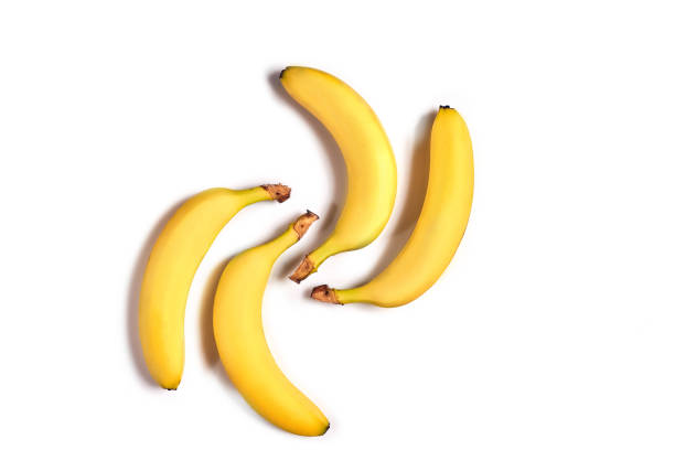 istock Ripe yellow bananas on a white background 909284160