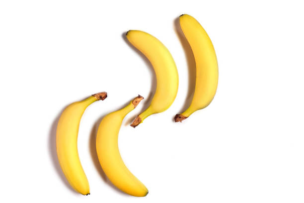 istock Ripe yellow bananas on a white background 909286432