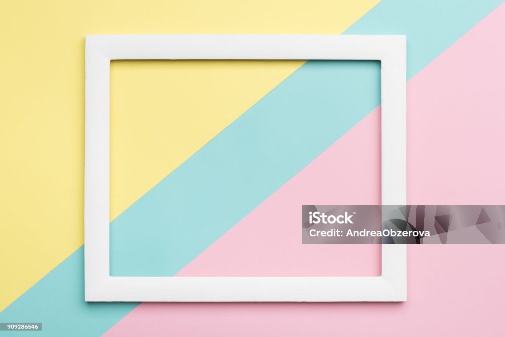 Abstract pastel colored paper texture minimalism background. Minimal geometric shapes and lines composition with empty picture frame. Picture Frame Stock Photo