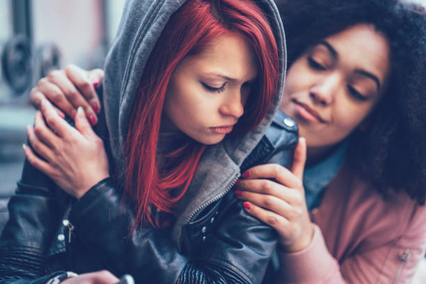 istock Girl caring about depressed friend 909288270