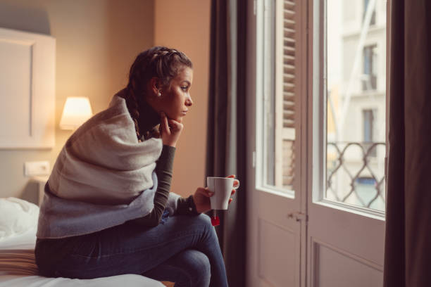 istock Depressed woman at home 909288406