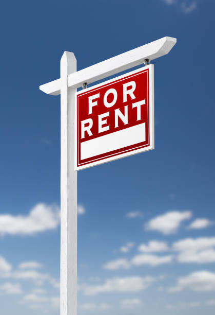 istock Right Facing For Rent Real Estate Sign on a Blue Sky with Clouds. 909290876