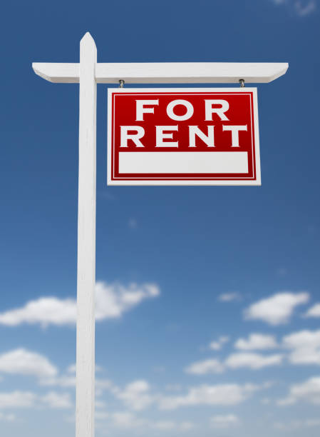 istock Right Facing For Rent Real Estate Sign on a Blue Sky with Clouds. 909290924