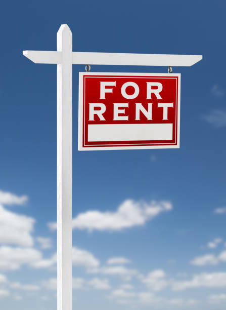 istock Right Facing For Rent Real Estate Sign on a Blue Sky with Clouds. 909290934