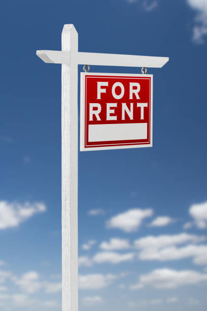 istock Right Facing For Rent Real Estate Sign on a Blue Sky with Clouds. 909290942