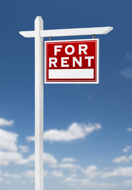istock Right Facing For Rent Real Estate Sign on a Blue Sky with Clouds. 909290946