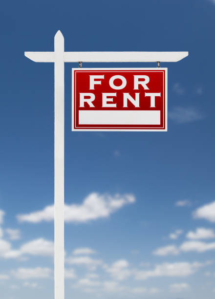 istock Right Facing For Rent Real Estate Sign on a Blue Sky with Clouds. 909290962