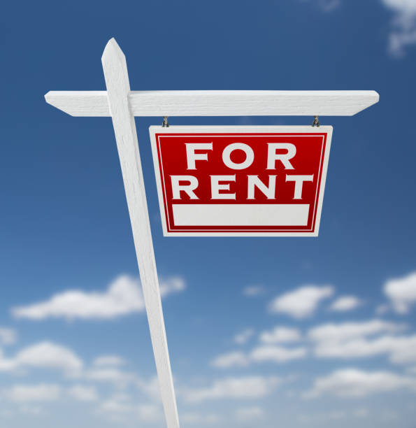 istock Right Facing For Rent Real Estate Sign on a Blue Sky with Clouds. 909290972