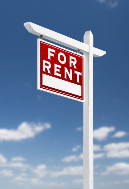 istock Left Facing For Rent Real Estate Sign on a Blue Sky with Clouds. 909291250