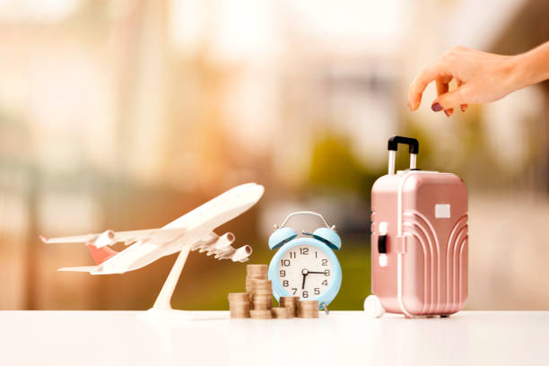 istock Miniature toy airplane and suitcases on bokeh background 909295152