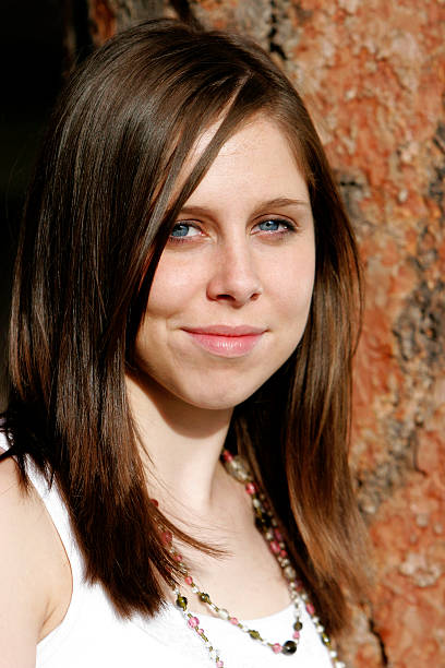 istock Beautiful Young Woman Against A Tree 90929726