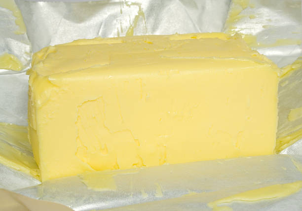 istock Pat of Butter in Foil full frame 90930080
