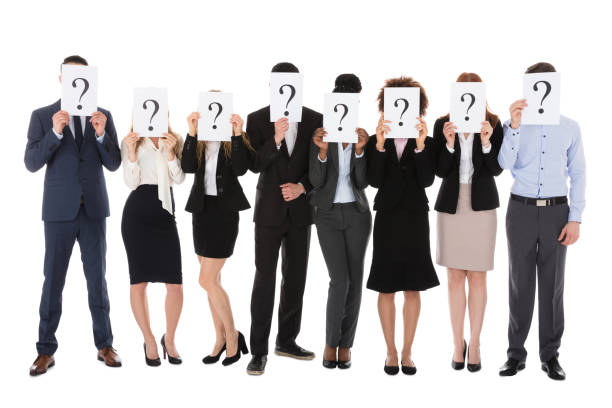 istock Businesspeople Hiding Behind Question Mark Sign 909303448