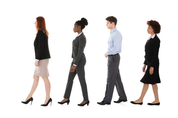 istock Multiracial Businesspeople Walking In Row 909303510