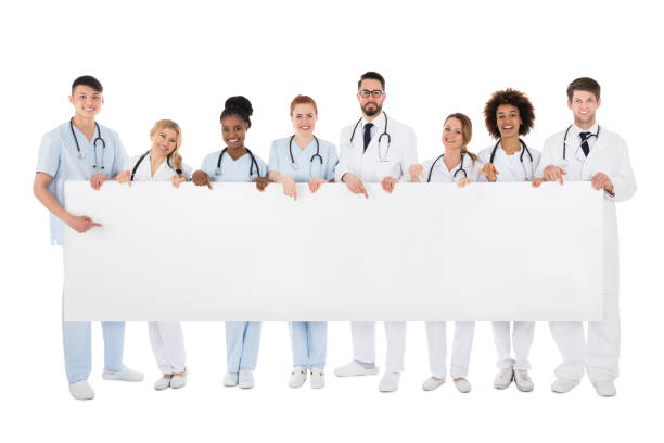 istock Group Of Medical Team Holding Blank Billboard 909303664